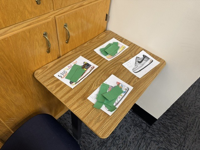 Students made decisions on which shoe(s) they would spend their limited amount of money on. 