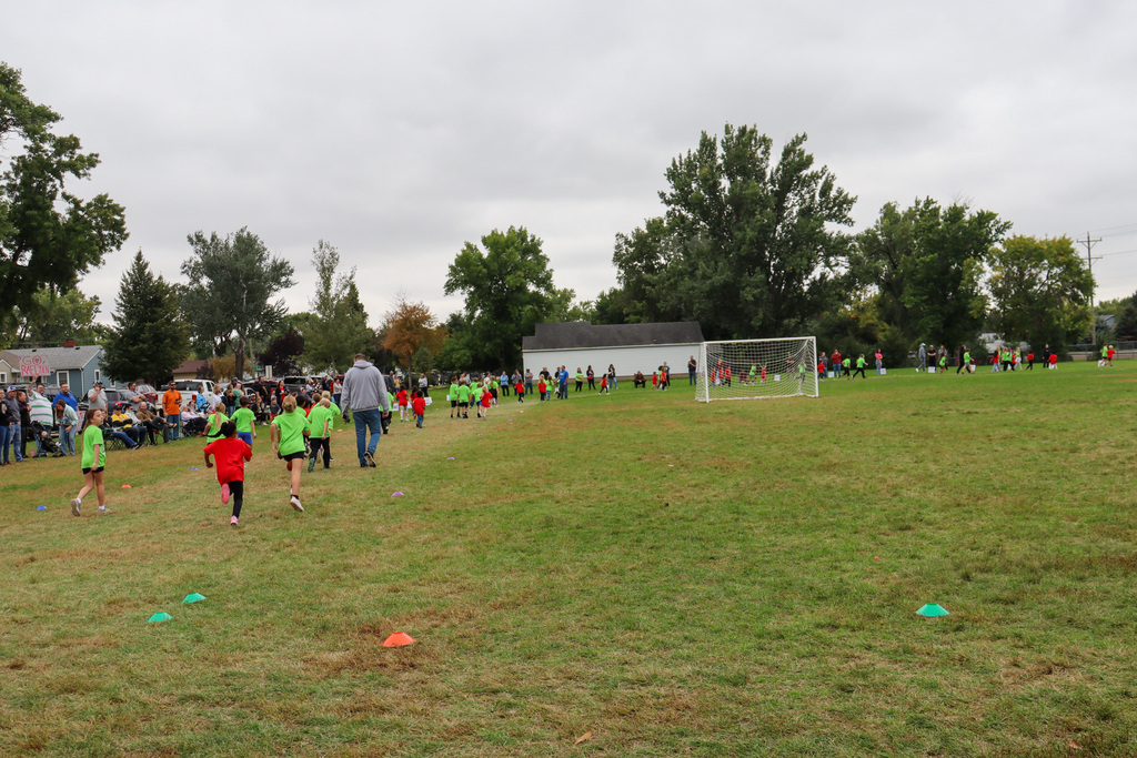 Simmons Elementary students participating in a fun run outside the school
