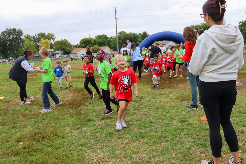 Simmons Elementary students participating in a fun run outside the school