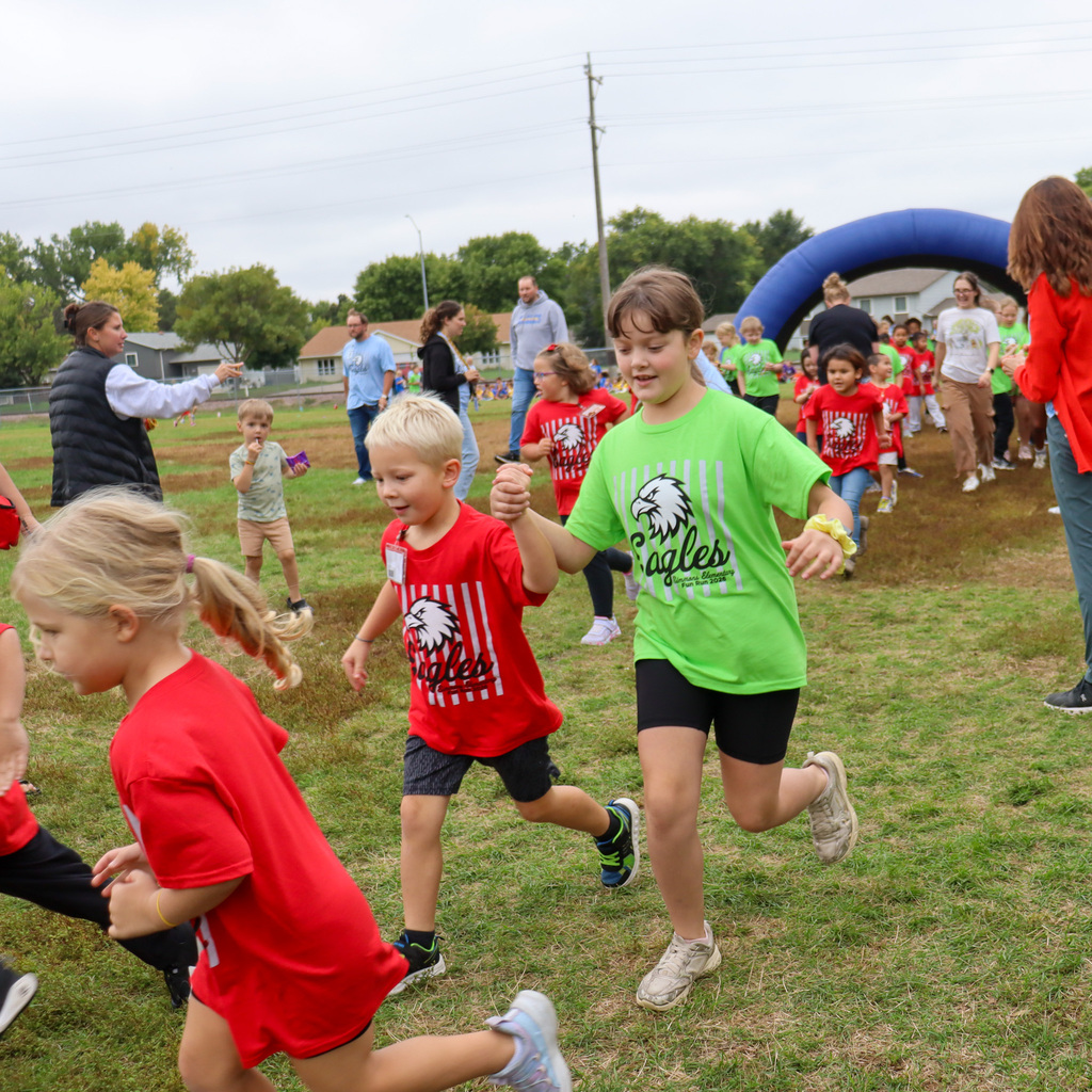 Simmons Elementary students participating in a fun run outside the school