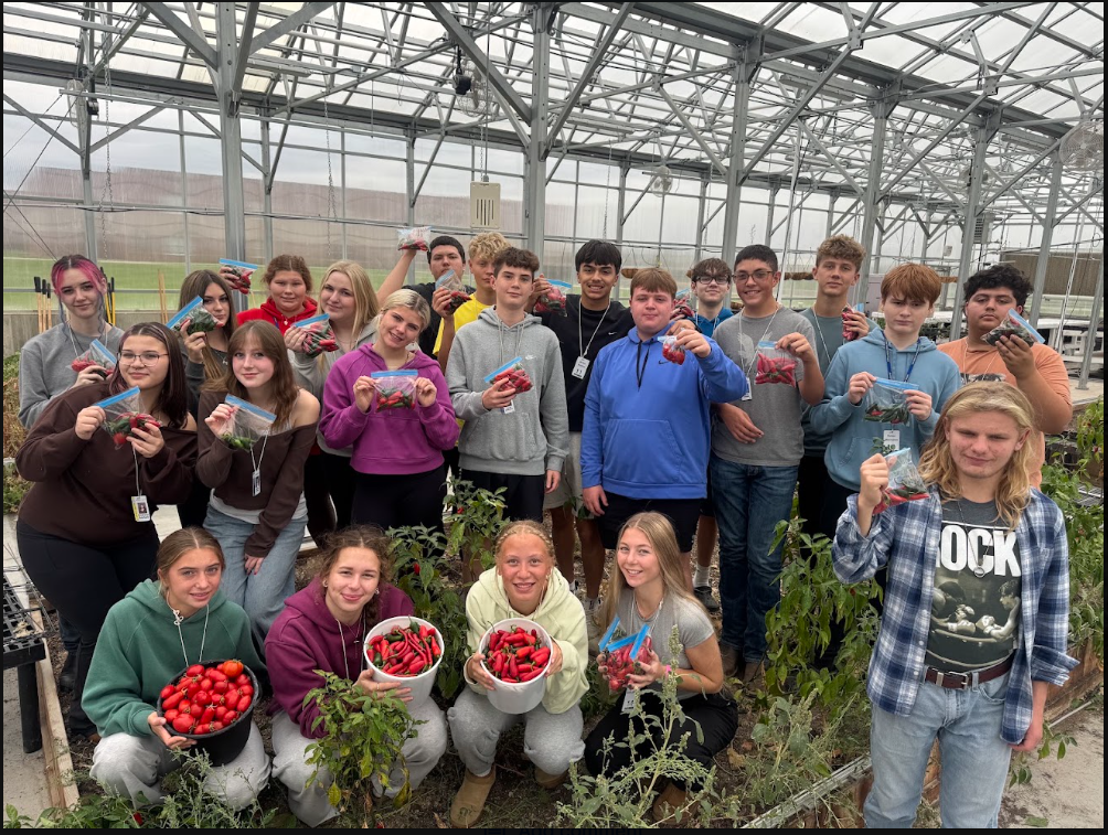 Group photo of FFA students in the greenhouse