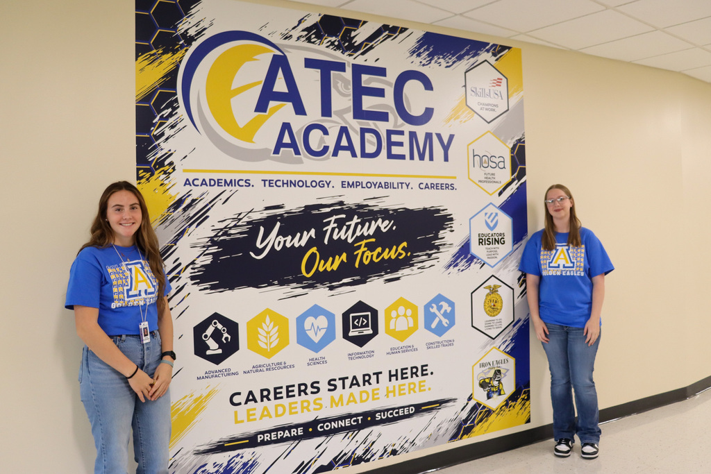 CHS students by the new ATEC sign