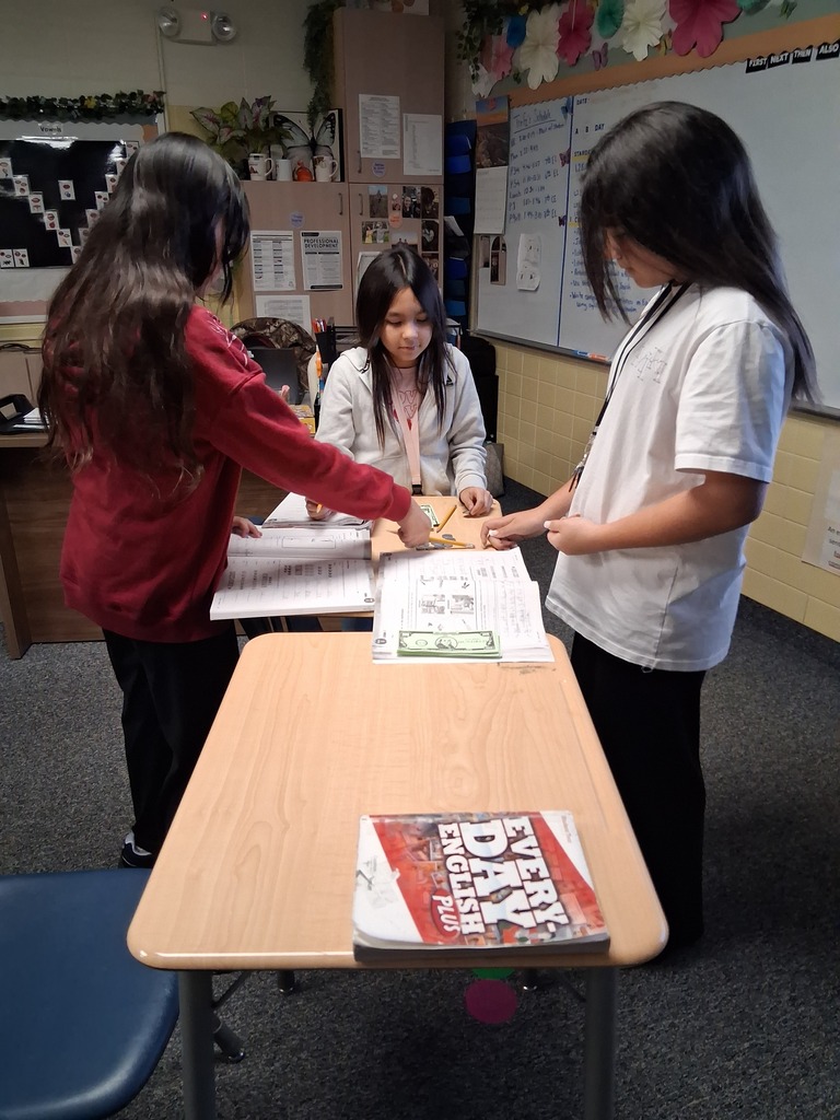 6th graders are identifying and counting money in English.