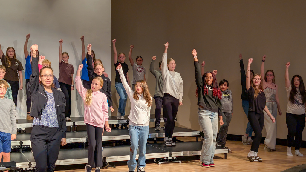 Holgate show choir students rehearsing with choreographer