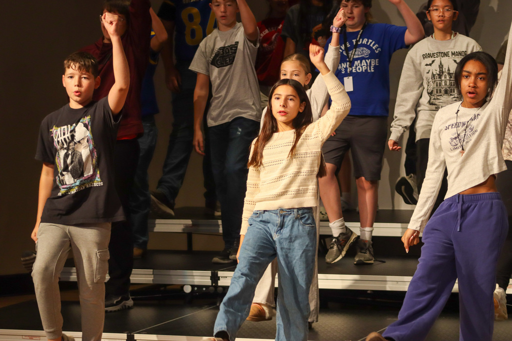 Holgate show choir students rehearsing with choreographer
