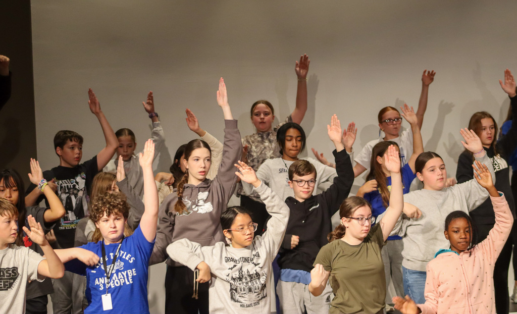 Holgate show choir students rehearsing with choreographer