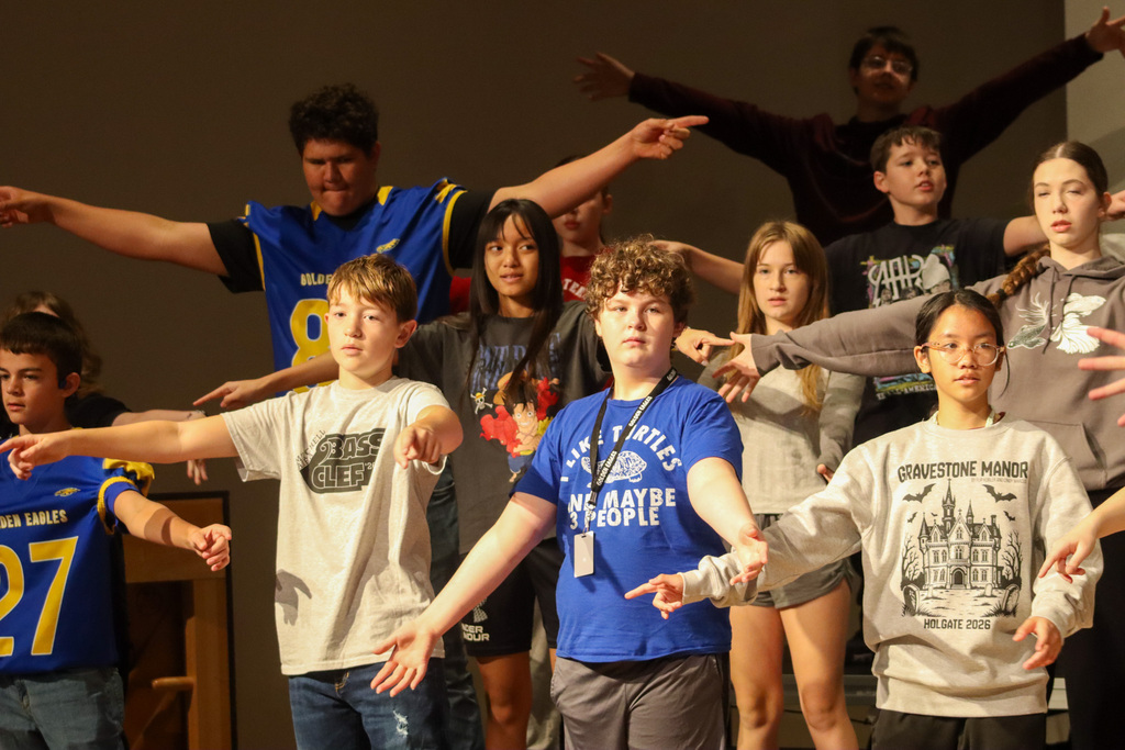 Holgate show choir students rehearsing with choreographer