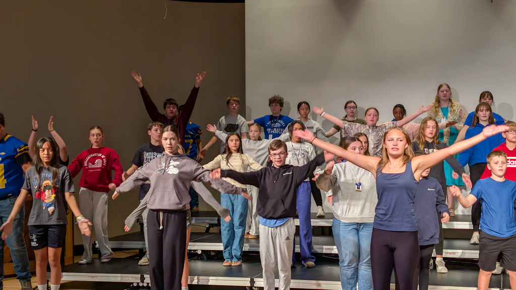 Holgate show choir students rehearsing with choreographer