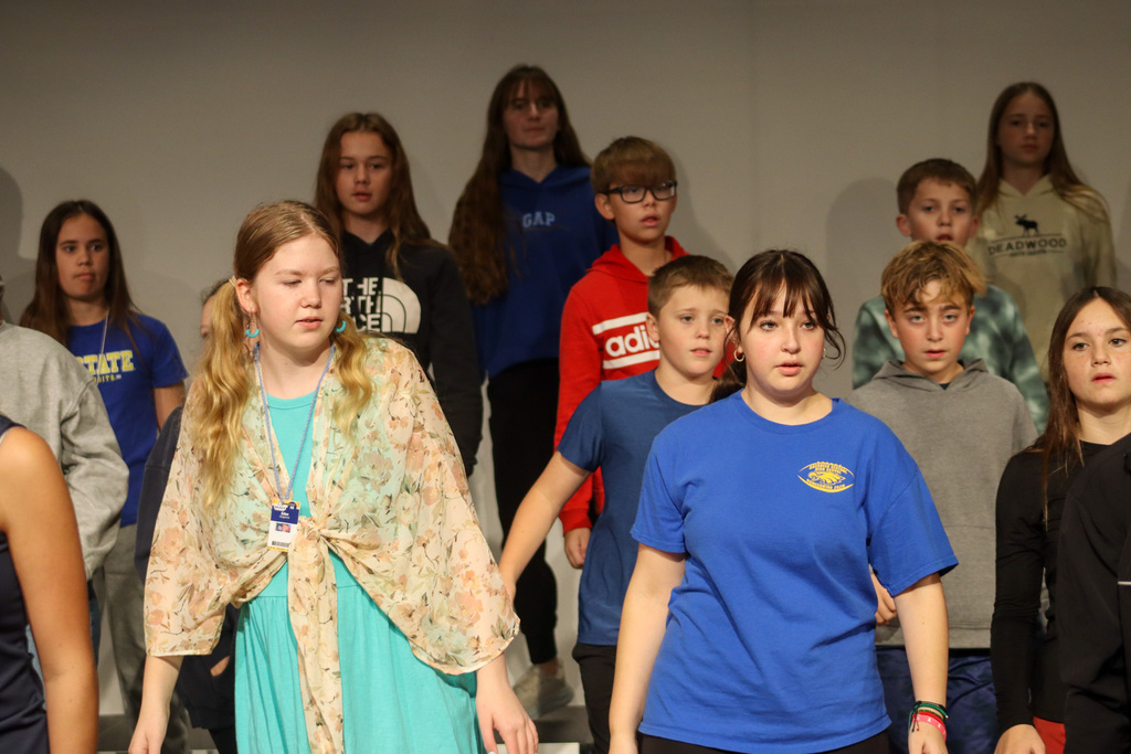 Holgate show choir students rehearsing with choreographer