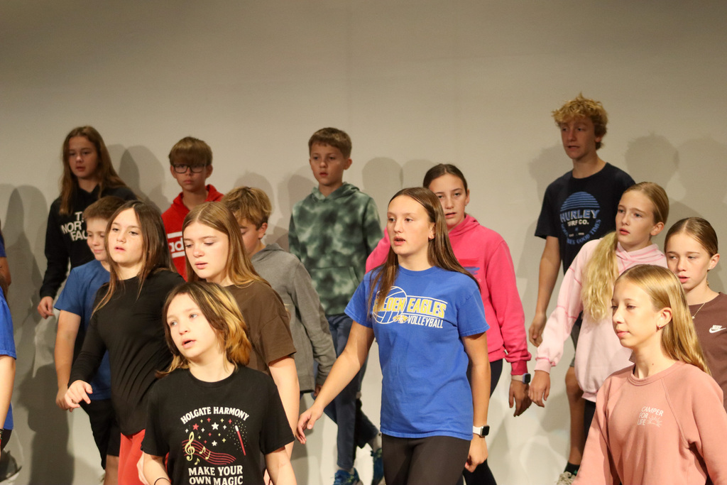 Holgate show choir students rehearsing with choreographer