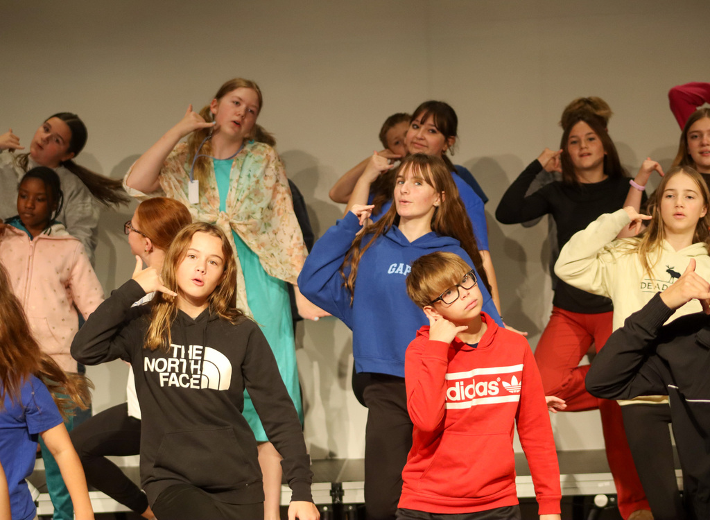 Holgate show choir students rehearsing with choreographer