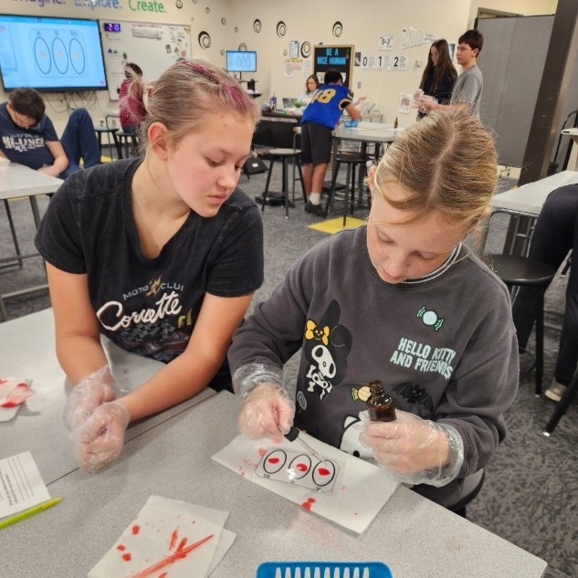 Students learning about blood typing