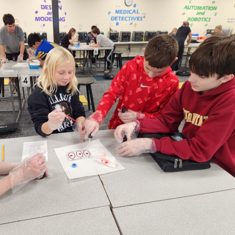 Students learning about blood typing