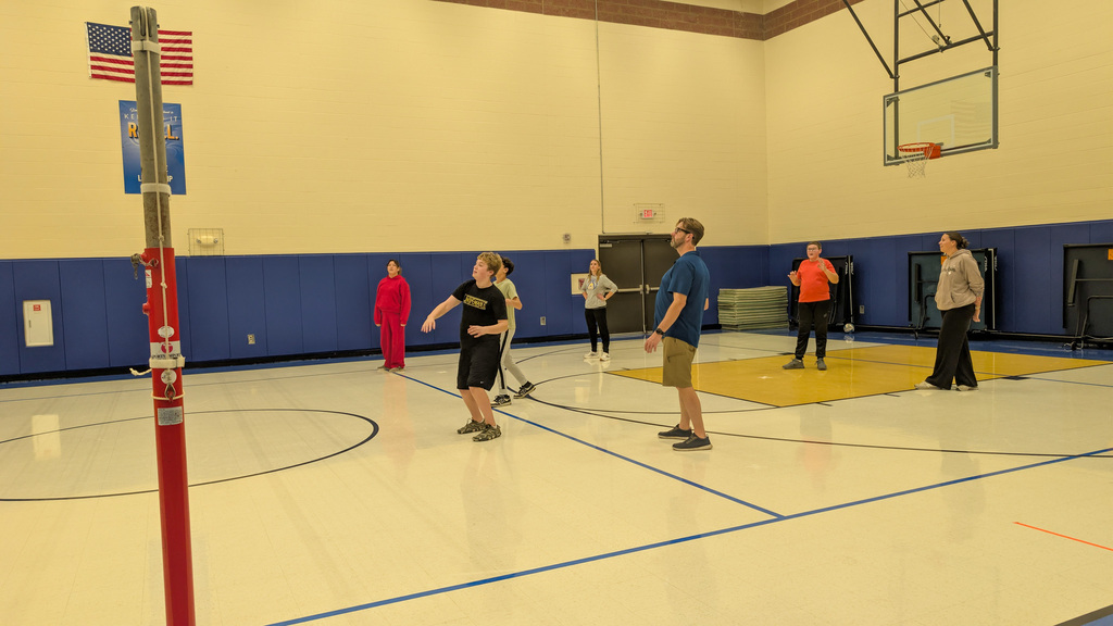 SMS students, family, and staff playing volleyball at Family Fun Night