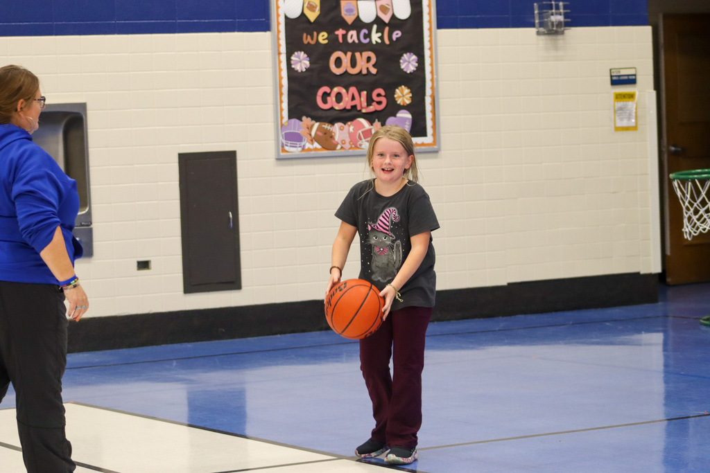SMS student playing basketball at Family Fun Night