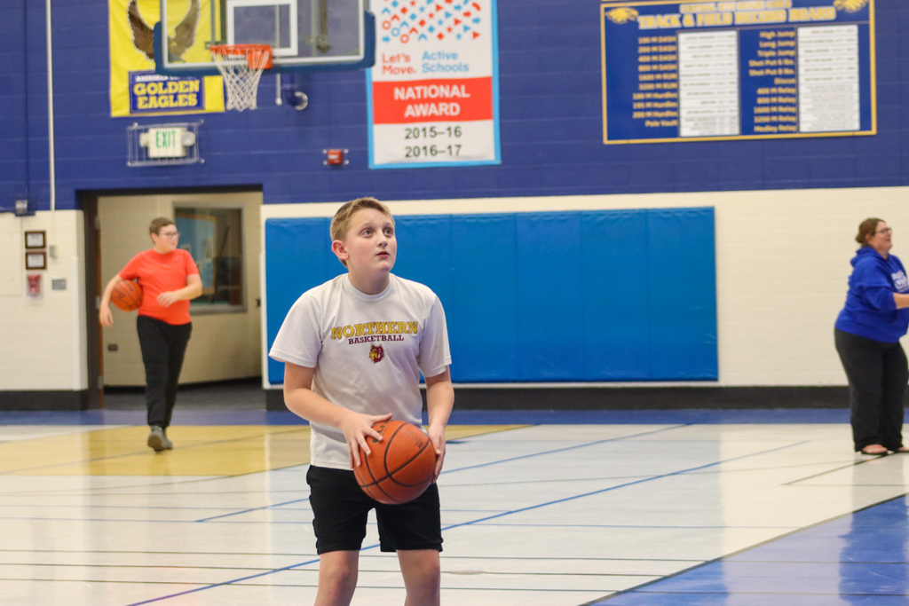 SMS student playing basketball at Family Fun Night