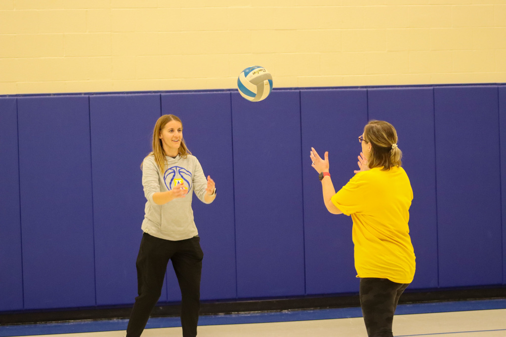 SMS staff playing volleyball at Family Fun Night