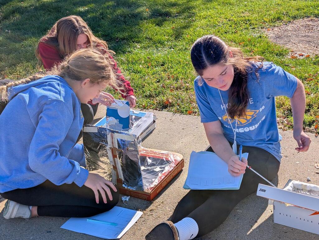 8th Graders wrapped up their unit on thermodynamics this morning by melting chocolate using the sun's radiation!