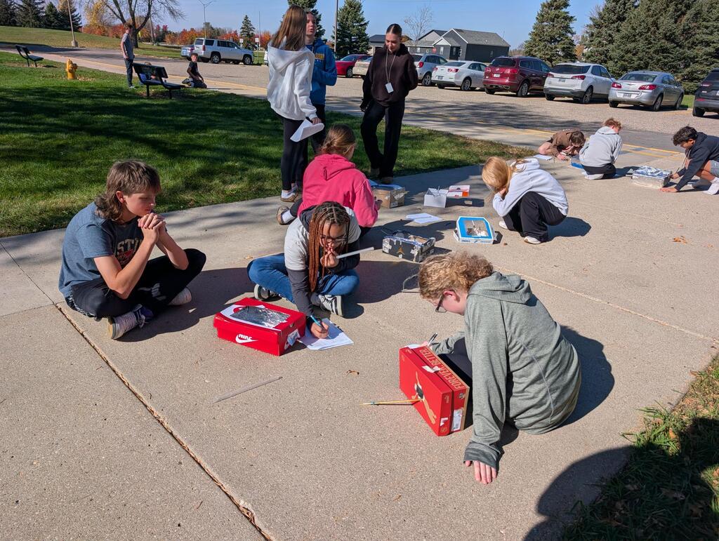 8th Graders wrapped up their unit on thermodynamics this morning by melting chocolate using the sun's radiation!