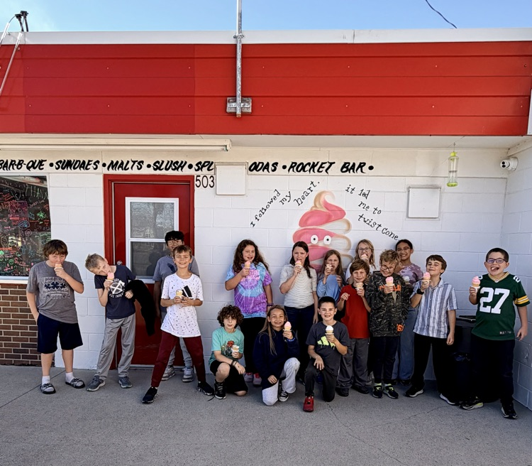 students in front of ice cream shop