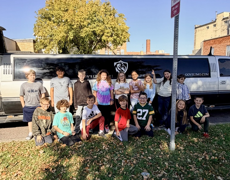 students in front of limo