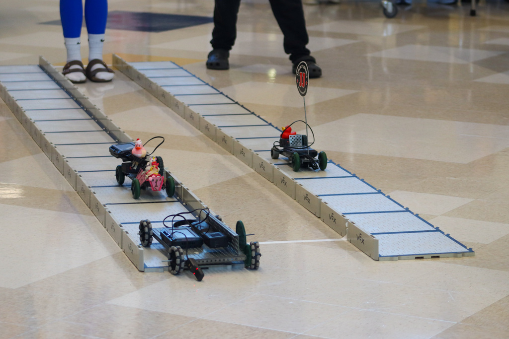SMS 8th graders racing the cars they made in robotics