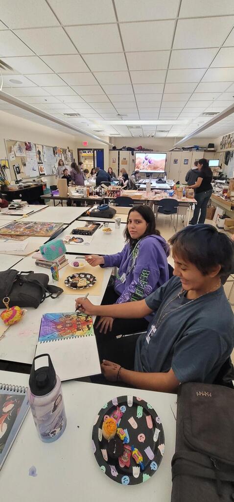 Camila and Apollo are enjoying the Spooky Cookies and sketching in art club this week!