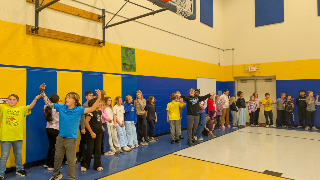5th graders waiting in line at the student-staff free throw contest