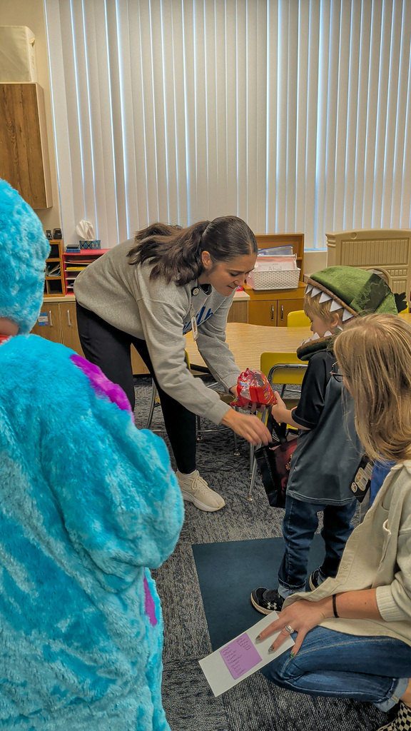 Students trick or treating at Lincoln Elementary