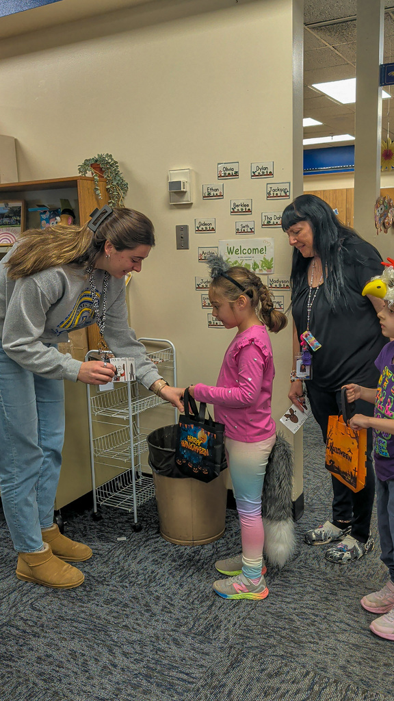Students trick or treating at Lincoln Elementary