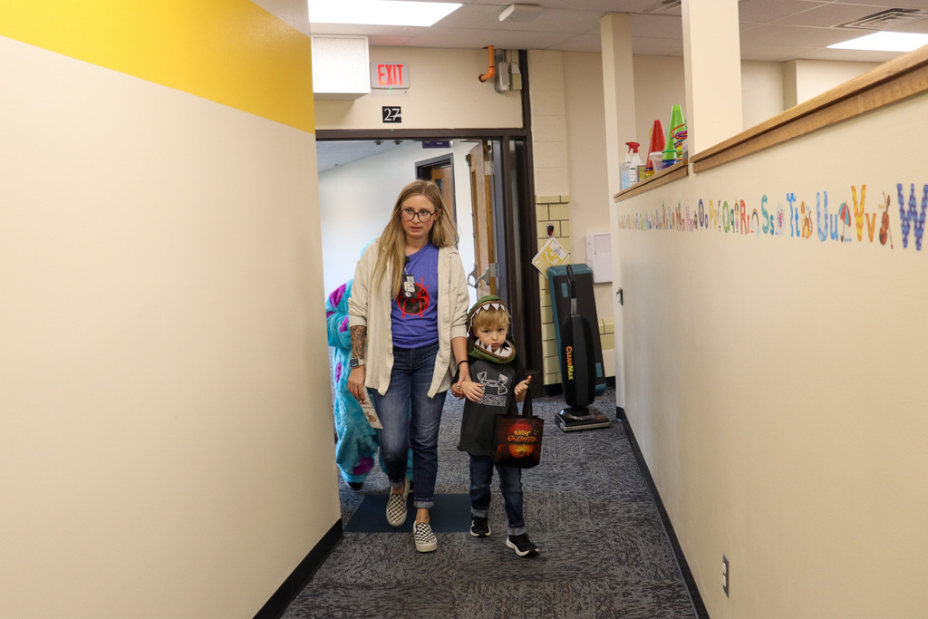 Students and teacher trick or treating at Lincoln Elementary