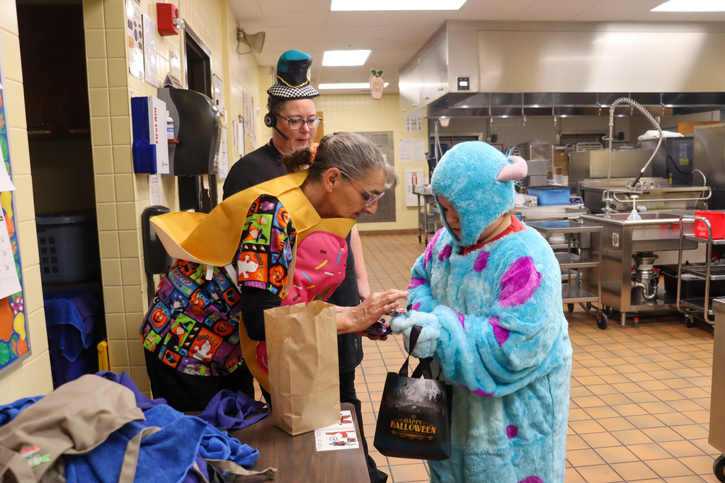 Students trick or treating at Lincoln Elementary