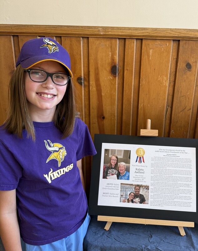 Kalista at the museum next to her winning essay