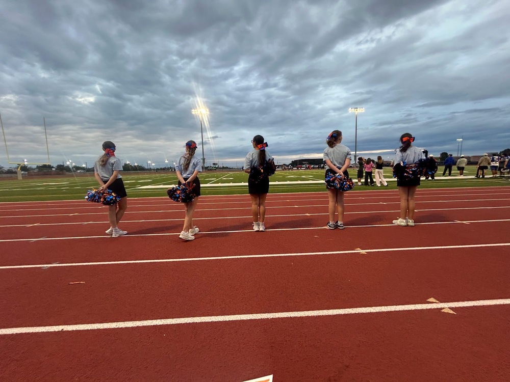 Members of the Madison Pep Squad cheer on the Bison football team