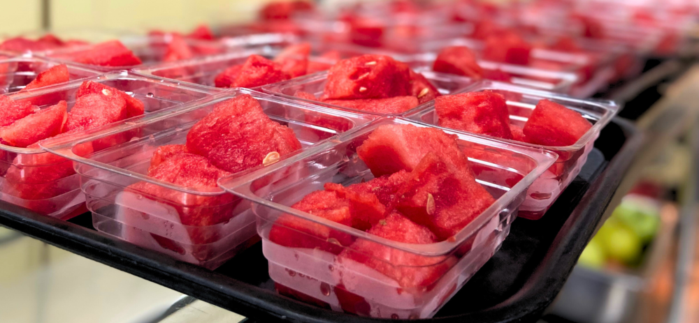 A photo of watermelon servings in a cafeteria