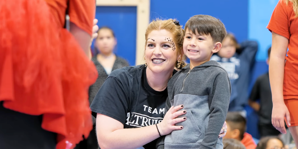 A photo of a Stafford teacher and a student at Stafford's annual Sorting Day