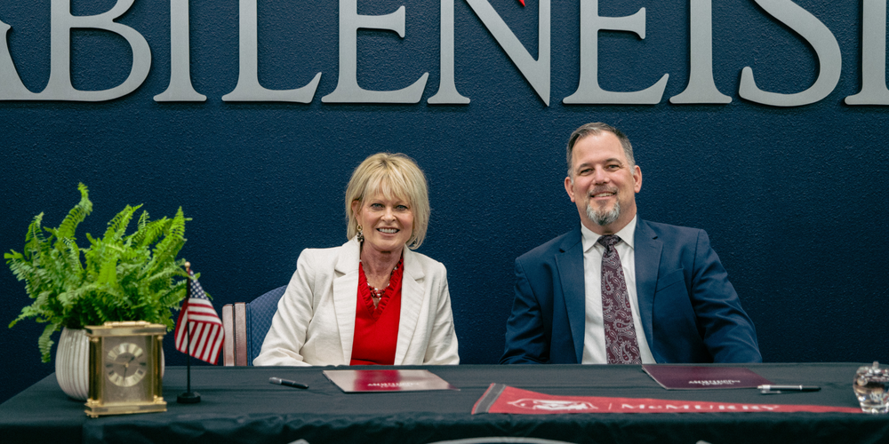 A photo of the McMurry University president and Dr. John Kuhn