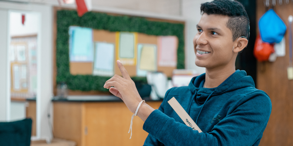 A photo of a student signing in class