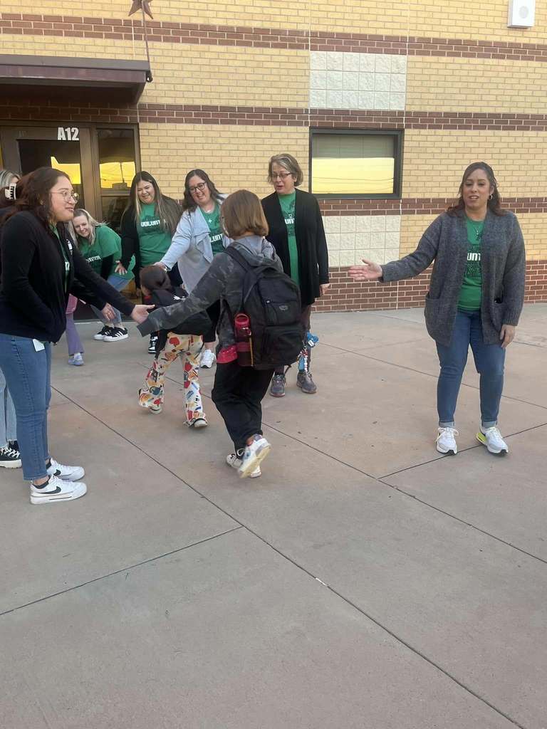 Students arriving at school during High Five Friday