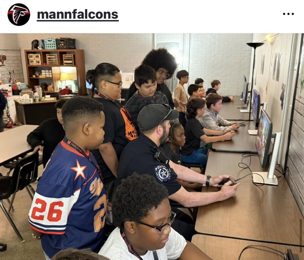 Officer Cox playing the Nintendo Switch with students.