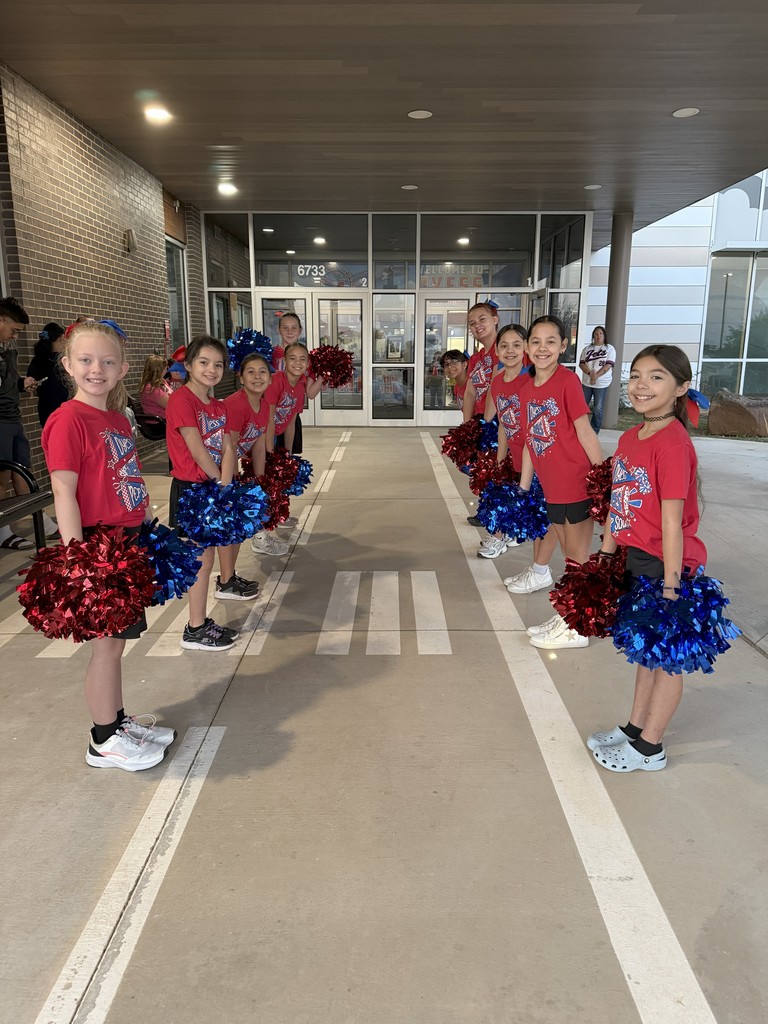 Dyess Pep Squad greeting students on Friday morning