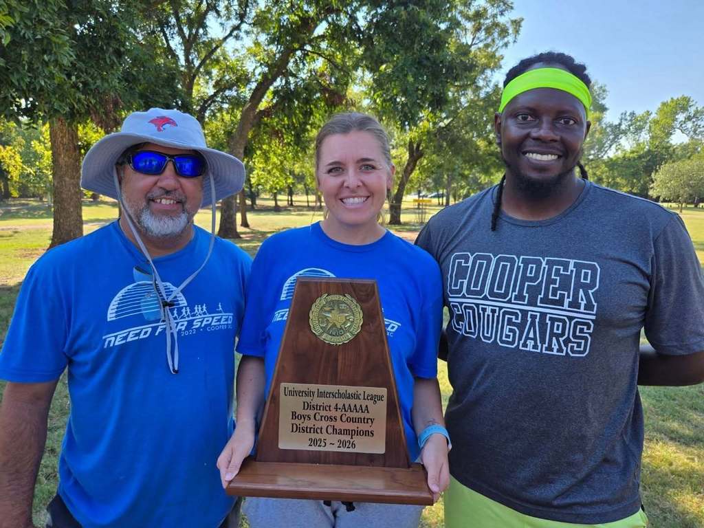 Three cross country coaches holding a large trophy for UIL District 4A Boys Cross Country District Champions.