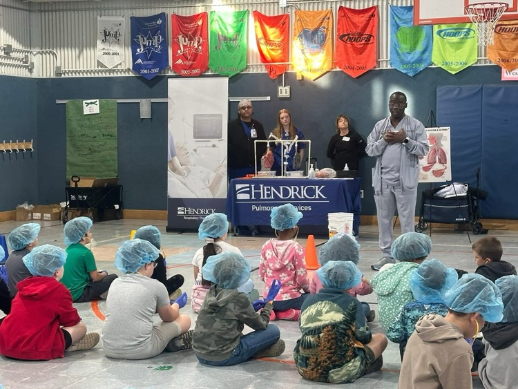 kids watching a presentation