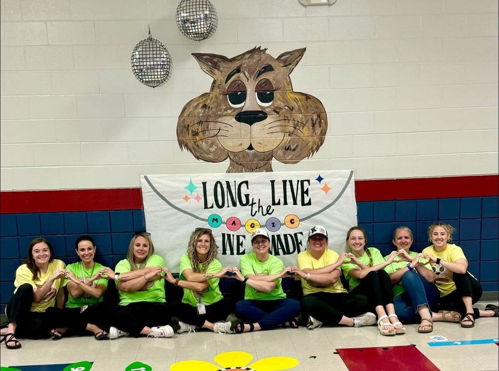 Teachers pose for a picture in their Field Day t-shirts