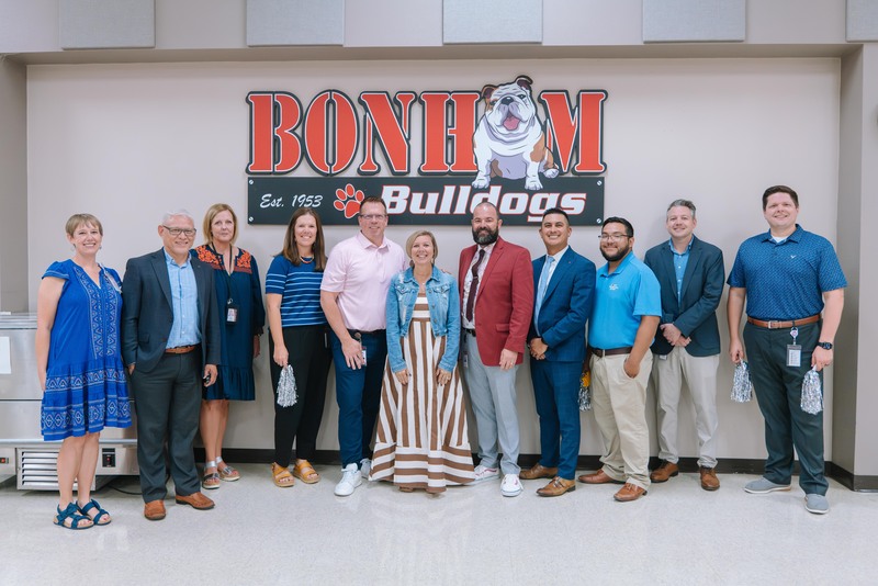 A photo of Mrs. DeLaGarza, school admin, and district leadership
