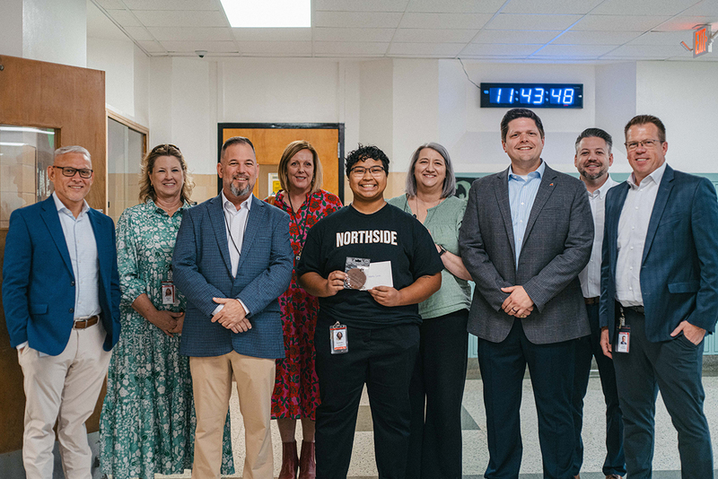 A photo of Samantha Lozano and campus and district administrators