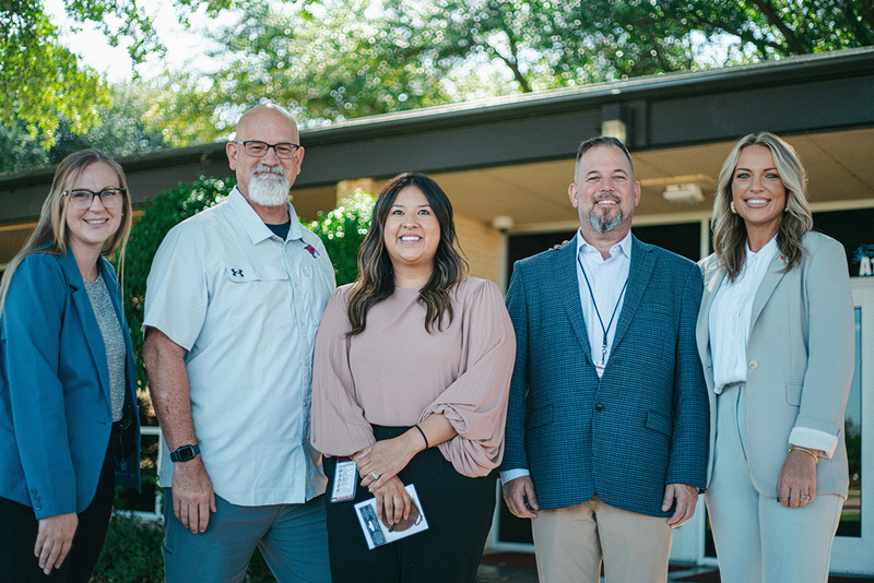 A photo of Aileen Bunting, campus and district administrator, and a representative from First Financial