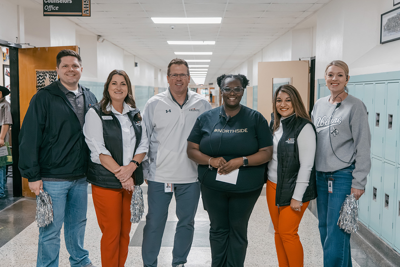 A photo of Ebonie Stewart and members of the prize patrol