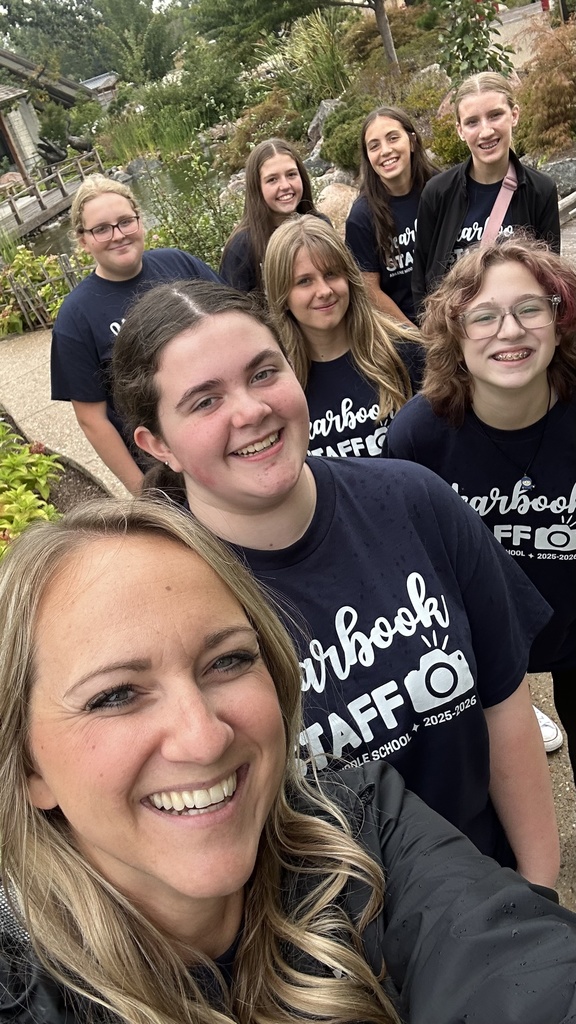 AMS Yearbook Staff and their sponsor, Mrs. Berns, smiling at the Topeka Zoo