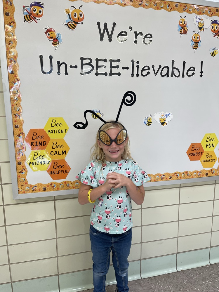 student with bee glasses